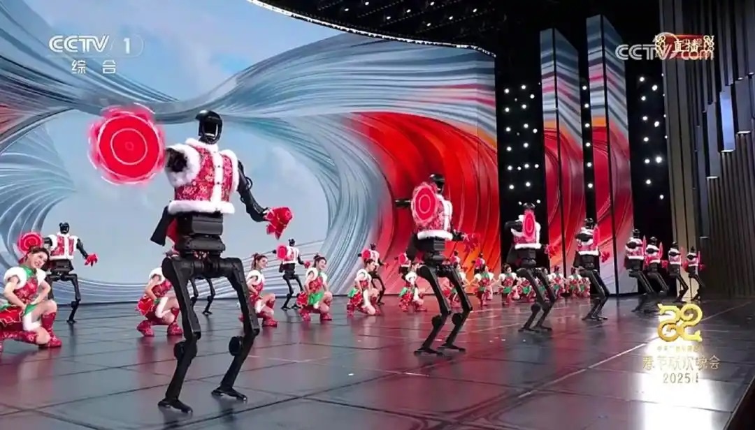 △今年春晚，宇樹科技人形機(jī)器人身穿東北特色的花棉襖扭秧歌，呈現(xiàn)出全新視覺效果。